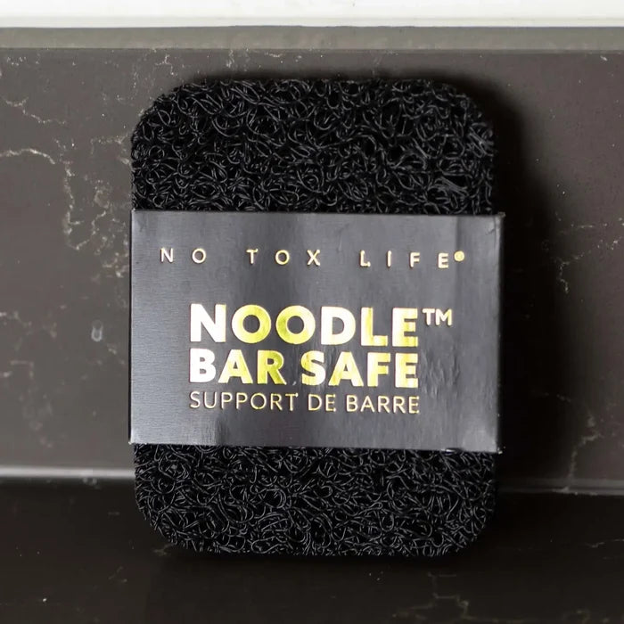 Black noodle bar with 'No Tox Life' label on a dark background