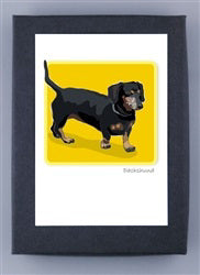 PAPER RUSSELLS - DACHSHUND BOXED CARDS feature a black dachshund with tan markings on a yellow background. Printed on FSC certified paper by PAPER RUSSELLS, these eco-friendly cards display “Dachshund” below the illustration.