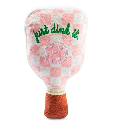 The HAUTE DIGGITY DOG PINK CHECKER PICKLEBALL PADDLE DOG TOY is a plush, paddle-shaped squeaky dog toy featuring a fun pink checkered design, an embroidered pickleball, the phrase "just dink it." in green, and a brown handle—perfect for pups who want to join in on your pickleball passion.