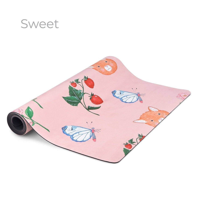 Pink yoga mat with fox and butterfly design on a white background