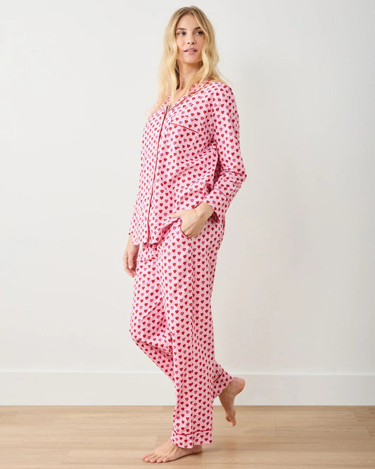 A seamless pattern of red and pink hearts arranged in neat rows on a light pink background, featured on the PRINTFRESH - MINI CANDY HEARTS LONG PAJAMA SET by PRINTFRESH, perfect for cozy Valentine's pajamas.