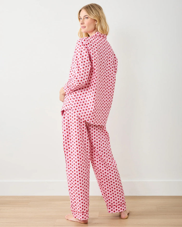 A seamless pattern of red and pink hearts arranged in neat rows on a light pink background, featured on the PRINTFRESH - MINI CANDY HEARTS LONG PAJAMA SET by PRINTFRESH, perfect for cozy Valentine's pajamas.