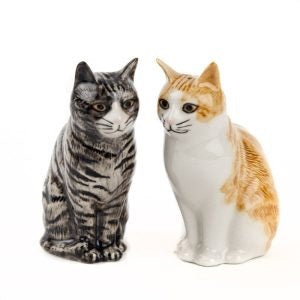 The QUAIL CERAMICS Squash & Patience Cat Salt & Pepper Shakers by QUAIL DESIGNS feature two hand-painted ceramic cat figurines sitting back to back—one in gray with black stripes and the other in orange with white patches. Each cat is looking away from the other, making this charming set a perfect gift for cat lovers.