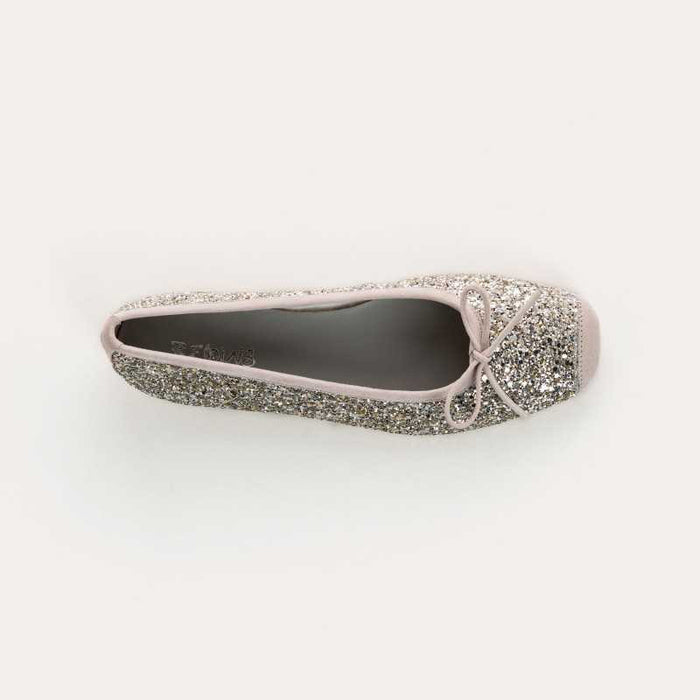 The REQINS Harmony Sequin Ballerina Flats in Ice feature silver glitter, a front bow, and a low heel, shown in side view against a plain light background.