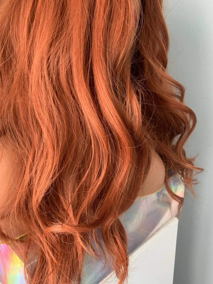 Riri Long Red Auburn Loose Curls Wig showcasing vibrant auburn and copper-red hues in loose curls.