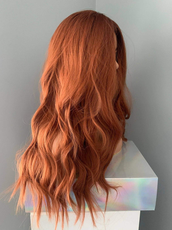 Back view of the Riri Long Red Auburn Loose Curls Wig displaying voluminous auburn waves.