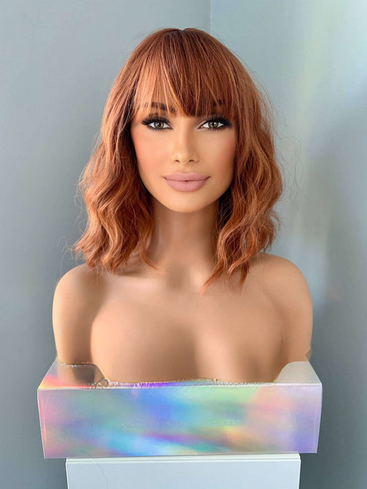 Robin Short Auburn Body Wave Wig with Bangs displayed on a mannequin, showcasing wavy texture and full bangs.