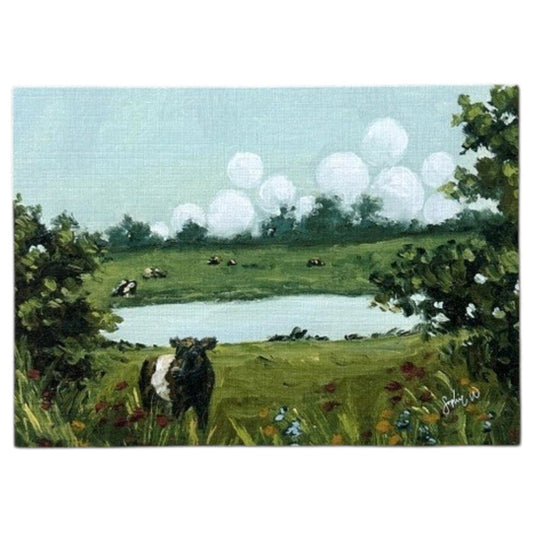Bring home the charm of the countryside with the SOPHIE WYATT STUDIO - WILD MEADOWS & BELTIES ART PRINT, 11X14. This fine art print by SOPHIE WYATT STUDIO features a scenic green landscape with a pond, trees, colorful flowers, and Belted Galloway cows under puffy white clouds on linen fabric.