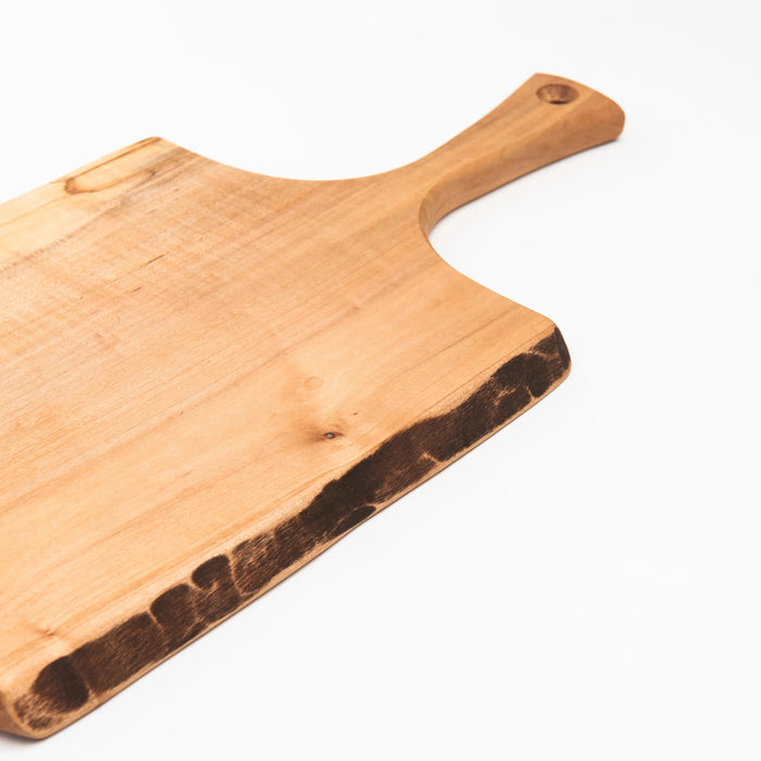 A 15-inch SPENCER PETERMAN Live Edge Spalted Ambrosia Maple Serving Board by Petermans Boards & Bowls Inc., featuring a unique live edge and handle, handcrafted in Massachusetts and photographed against a white background.