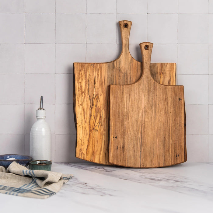 A 15-inch SPENCER PETERMAN Live Edge Spalted Ambrosia Maple Serving Board by Petermans Boards & Bowls Inc., featuring a unique live edge and handle, handcrafted in Massachusetts and photographed against a white background.
