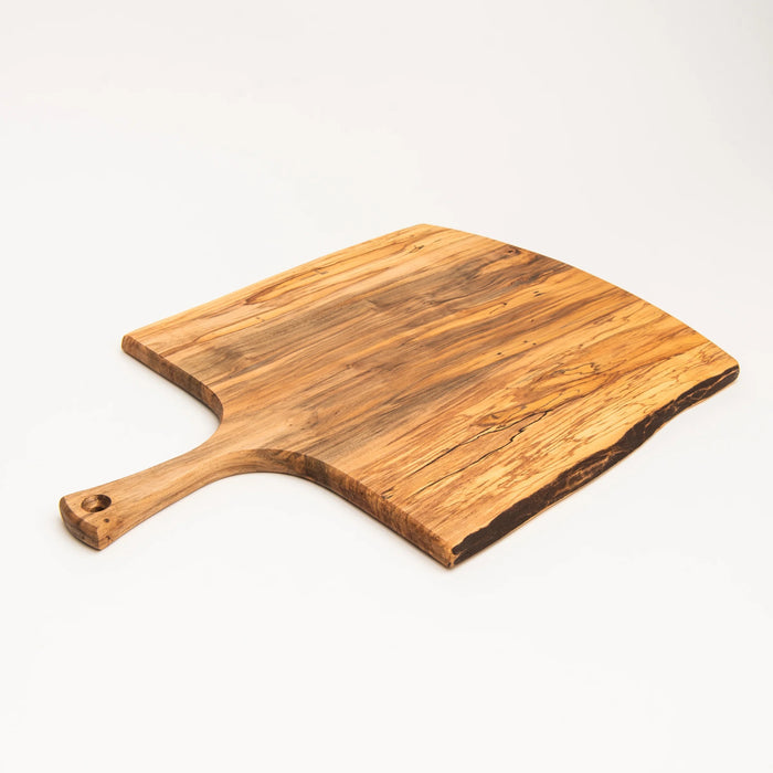 The SPENCER PETERMAN Live Edge Spalted Ambrosia Maple Serving Board 21" by Petermans Boards & Bowls Inc is a rectangular, handcrafted serving board with a handle and a hole for hanging, displayed on a white background.