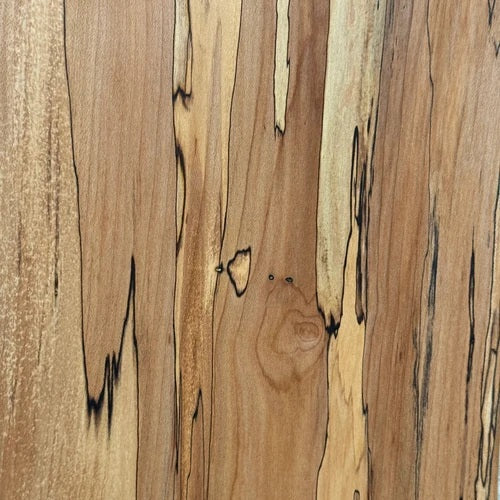 Handcrafted by PETERMANS BOARDS & BOWLS INC, the SPENCER PETERMAN - NATURAL EDGE SPALTED MAPLE RECTANGULAR BOARD 15" features a beautiful natural spalted maple grain, slightly angled sides, and a convenient small hole in the top right corner for hanging. Its dark rustic edges highlight the wood's unique character, making it an elegant choice for serving charcuterie or as a decorative cutting board.