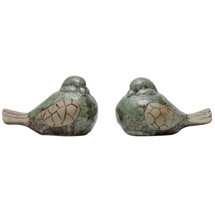 The CREATIVE COOP STONEWARE BIRD set features two stoneware bird figurines with pale green bodies, beige wings and tails, finished with a subtle reactive glaze—a charming accent for any space.
