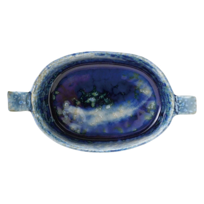 The CREATIVE COOP Stoneware Mini Baker features two side handles and a blue reactive crackle glaze, finished with unique speckled patterns.