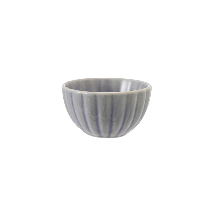 The CREATIVE COOP STONEWARE RIBBED BOWL IN LIGHT BLUE is a small, round bowl with vertical ridges and a reactive glaze. Measuring 2" tall by 3.5" wide, it's perfect for farmhouse kitchen decor and is shown centered on a white background.