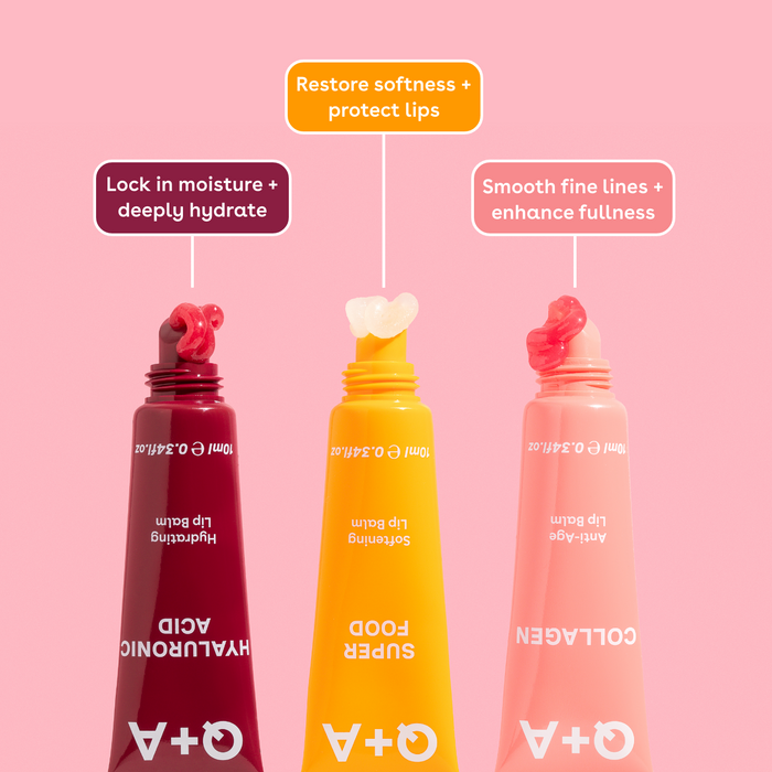 Three Q+A lip balms with benefit labels on a pink background