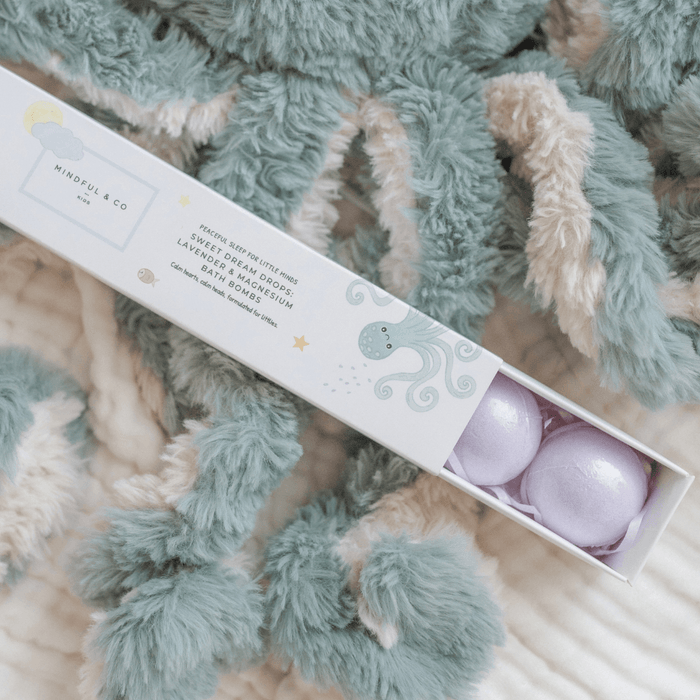 Box of bath bombs with a textured blanket background