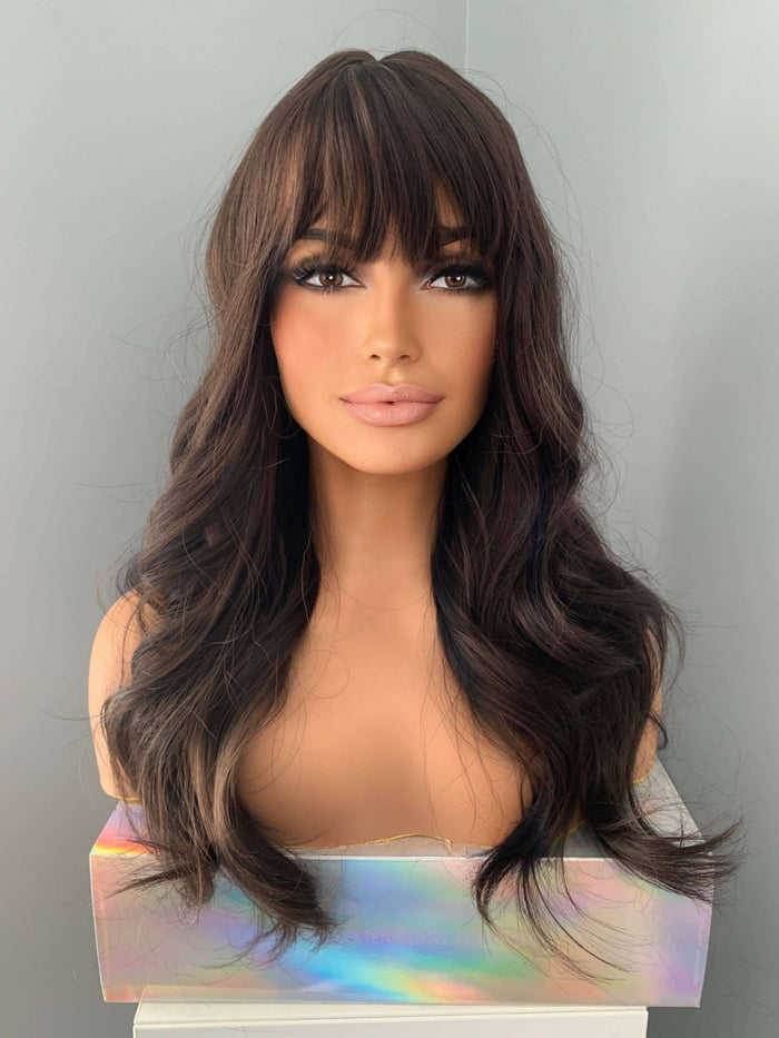 Tasha Long Dark Chocolate Brown Wig with Bangs showcasing soft waves and full fringe.