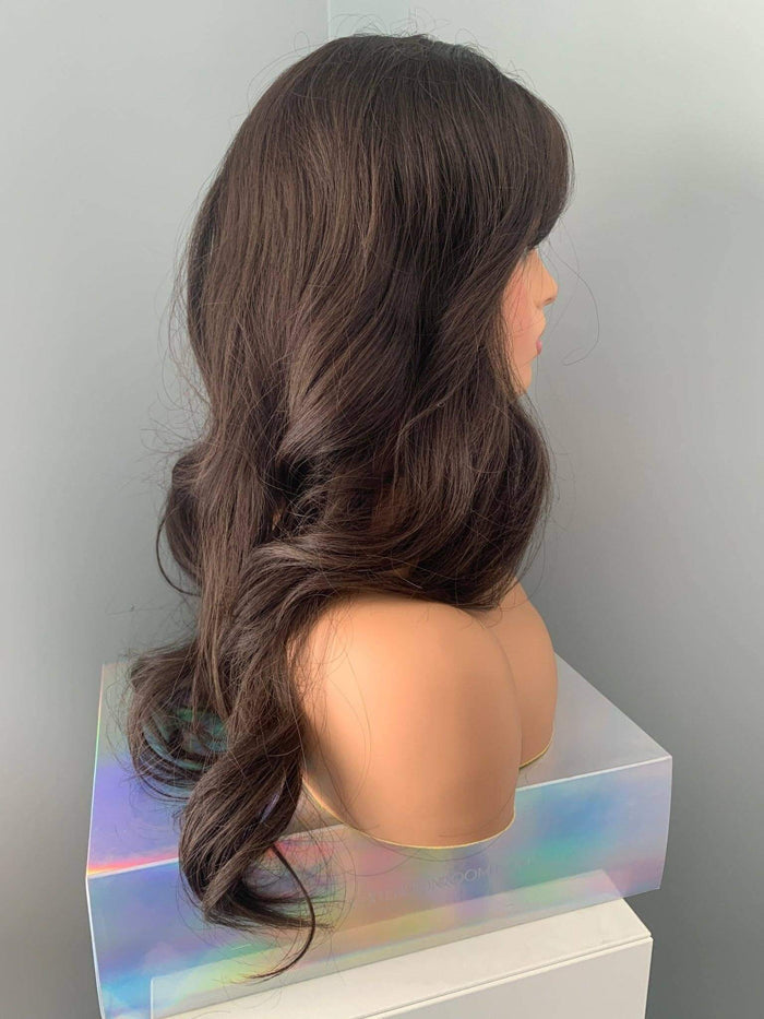 Tasha Long Dark Chocolate Brown Wig with Bangs displaying soft waves and a full fringe on a mannequin.
