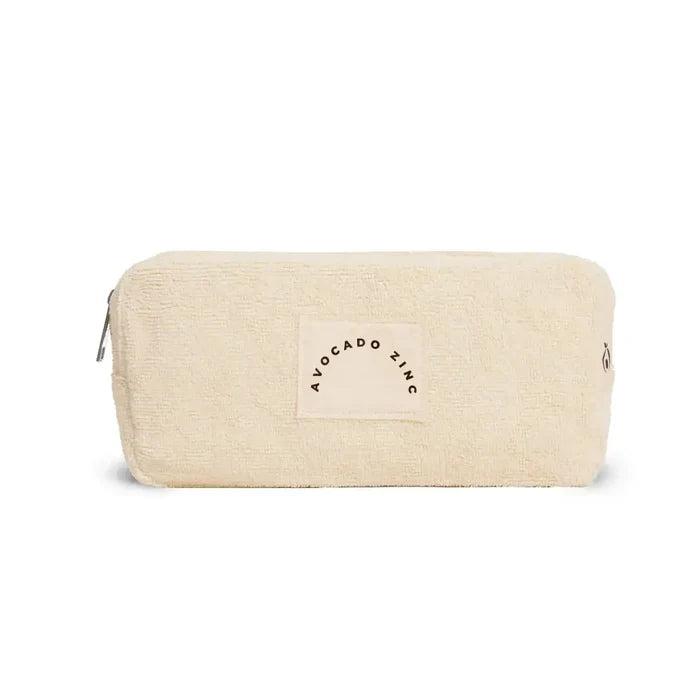 Beige toiletry bag with 'Avocado & Zinc' logo on a white background