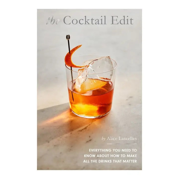 The cover of THE COCKTAIL EDIT BY ALICE LASCELLES (CHRONICLE BOOKS) features a clear glass with a classic cocktail, orange twist, and large ice on marble. The subtitle: “Everything you need to know about how to make all the drinks that matter.”.