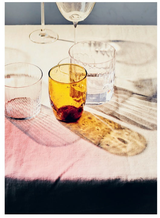 The cover of THE COCKTAIL EDIT BY ALICE LASCELLES (CHRONICLE BOOKS) features a clear glass with a classic cocktail, orange twist, and large ice on marble. The subtitle: “Everything you need to know about how to make all the drinks that matter.”.