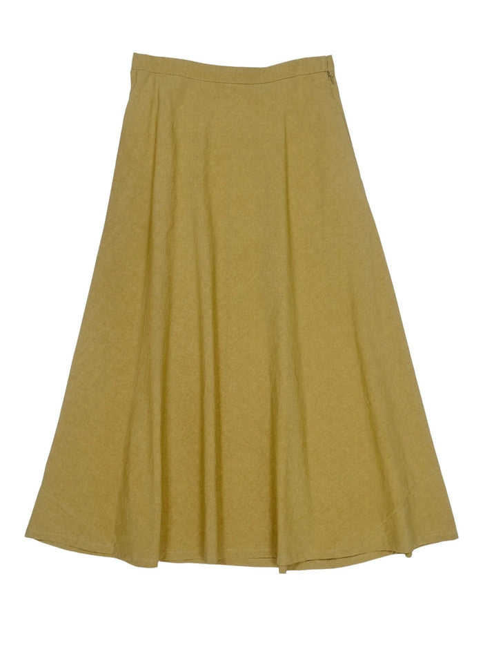The MARNIE SKIRT by THE LITTLE PROJECT is a mustard yellow A-line design made in Los Angeles. It has a smooth texture, subtle pleats, and a side zipper, and is showcased on a plain white background.