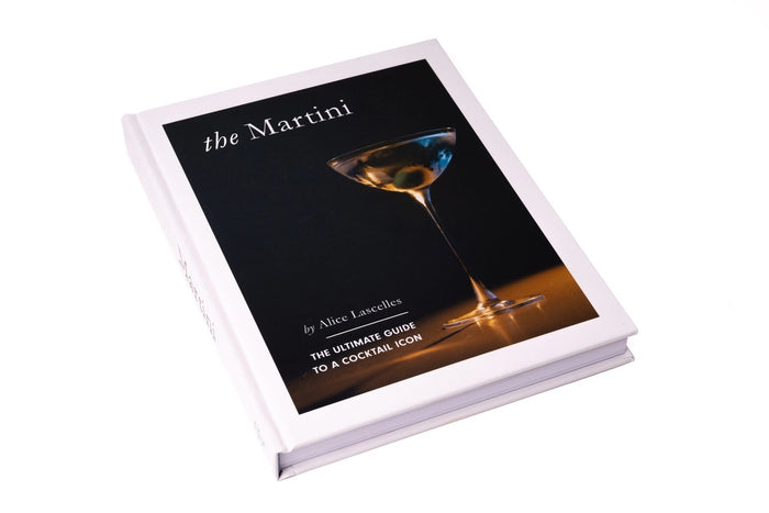 The Martini Cocktail Guide Book by Alice Lascelles from Chronicle Books features a classic martini glass with a green olive on a dark blue cover and the subtitle: "The Ultimate Guide to a Cocktail Icon and Essential Martini Recipes.