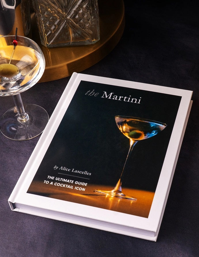 The Martini Cocktail Guide Book by Alice Lascelles from Chronicle Books features a classic martini glass with a green olive on a dark blue cover and the subtitle: "The Ultimate Guide to a Cocktail Icon and Essential Martini Recipes.