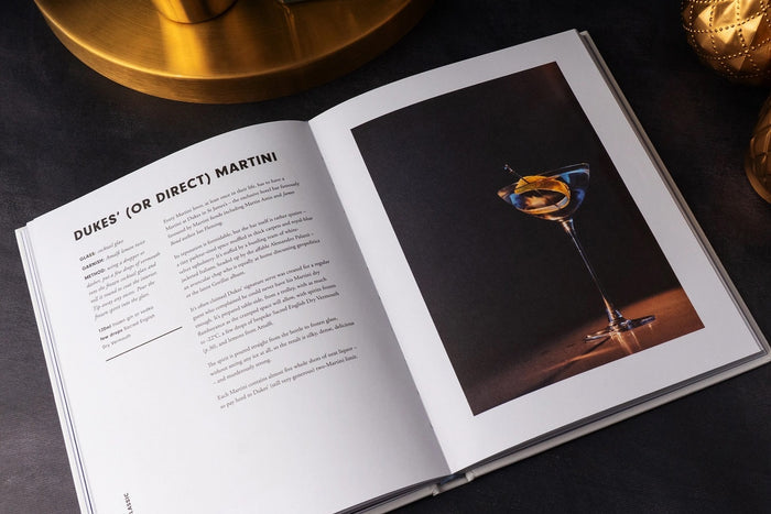 The Martini Cocktail Guide Book by Alice Lascelles from Chronicle Books features a classic martini glass with a green olive on a dark blue cover and the subtitle: "The Ultimate Guide to a Cocktail Icon and Essential Martini Recipes.