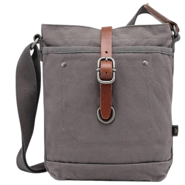 The TSD BRAND Forest Zip Crossbody Bag in Grey features a wide black strap, brown leather buckle accent, metal rivets, and a subtle side logo tag for a military-inspired look.