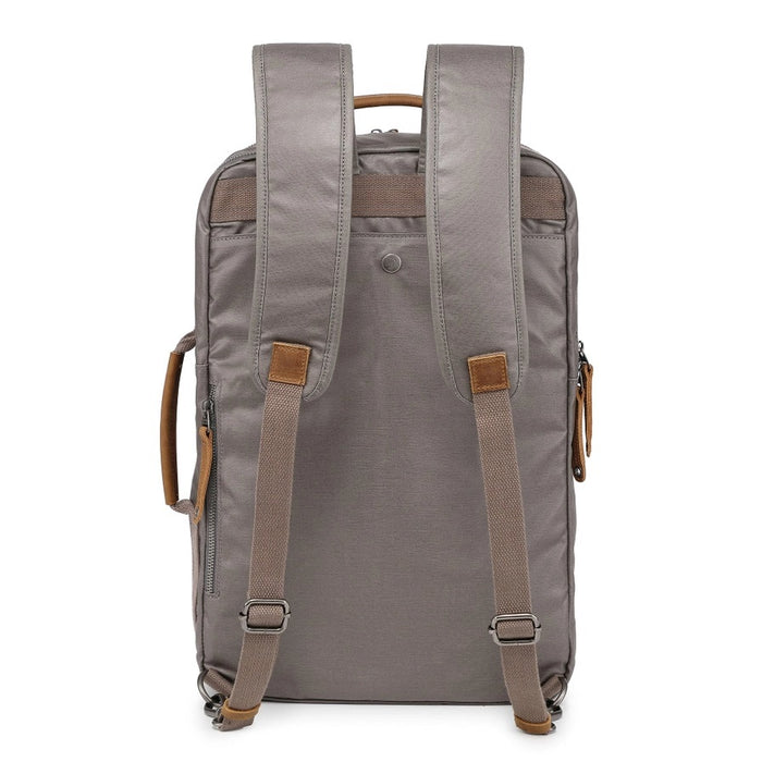 A close-up of the TSD BRAND - MADRONE Coated Canvas Backpack in Grey shows its brown leather accents and an unzipped front pocket with a black wallet partially visible inside.