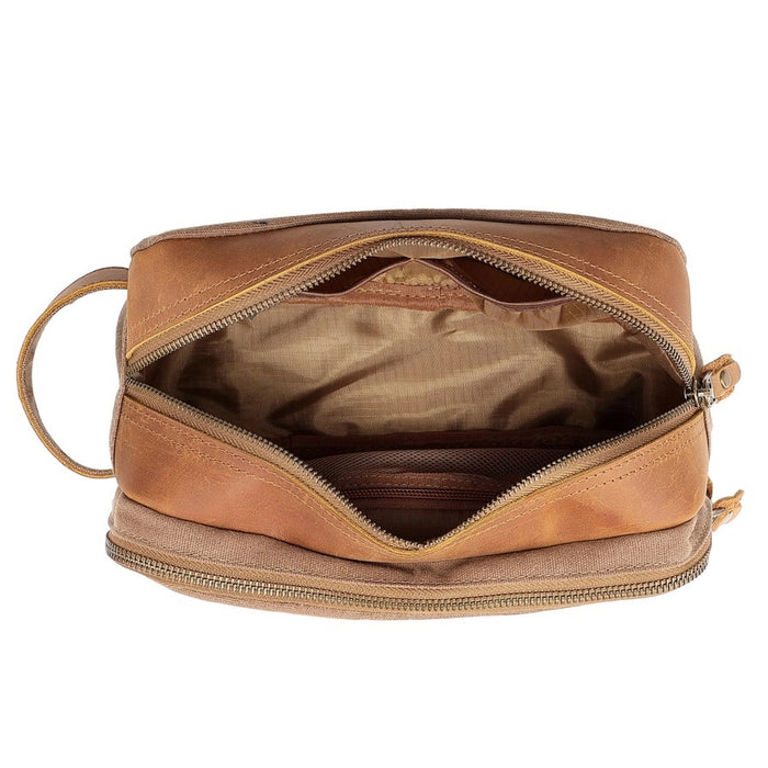 The TSD BRAND Turtle Ridge Toiletry Bag in khaki features leather accents, two zippered compartments, a side handle, and a small logo patch on the front pocket.