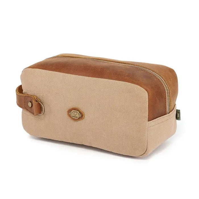 The TSD BRAND - VALLEY OAK TOILETRY BAG IN KHAKI is a handcrafted toiletry bag with a handle, shown open from above to reveal its empty beige fabric-lined interior—perfect for organized travel.