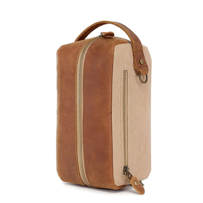 The TSD BRAND - VALLEY OAK TOILETRY BAG IN KHAKI is a handcrafted toiletry bag with a handle, shown open from above to reveal its empty beige fabric-lined interior—perfect for organized travel.