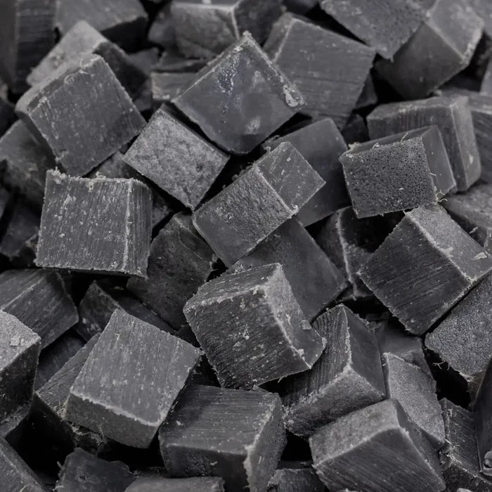Close-up of dark gray cubes with a rough texture