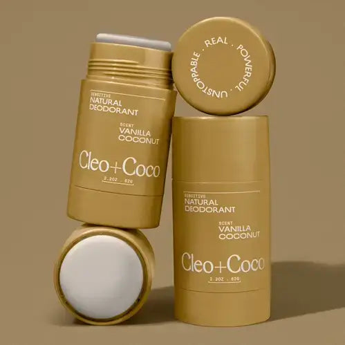 Cleo+Coco natural deodorant sticks on a brown background