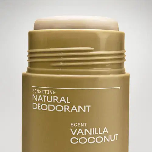 Beige deodorant stick with 'Sensitive Natural Deodorant' and 'Vanilla Coconut' text on a light gray background