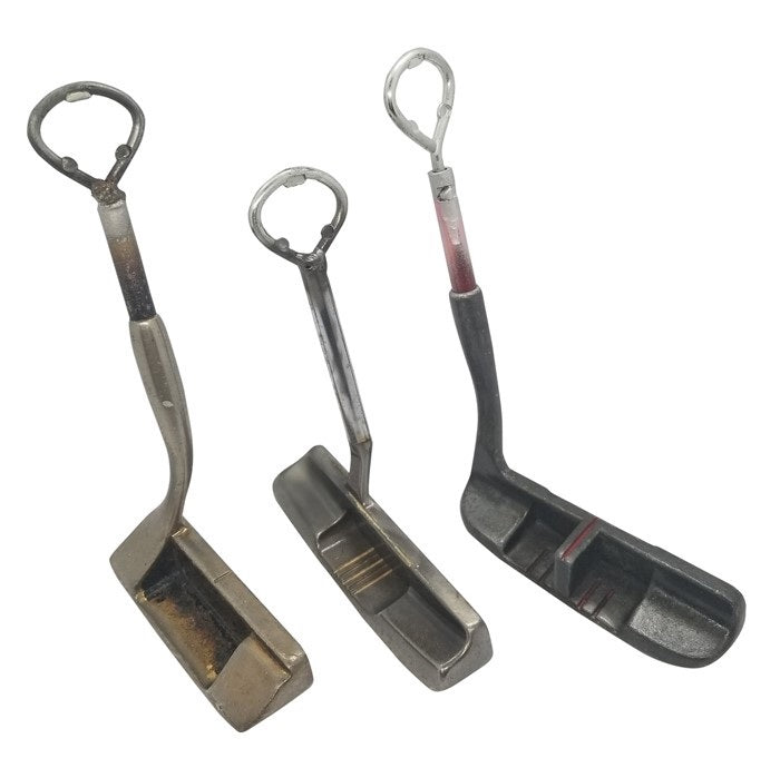 The VINTAGE PUTTER BOTTLE OPENER from VINTAGE GOLF GIFTS transforms three vintage golf putters into unique bottle openers, each featuring a worn, metallic finish—ideal recycled barware gifts for golf lovers.