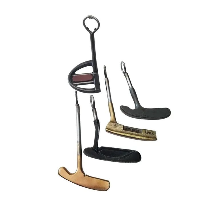 The VINTAGE PUTTER BOTTLE OPENER from VINTAGE GOLF GIFTS transforms three vintage golf putters into unique bottle openers, each featuring a worn, metallic finish—ideal recycled barware gifts for golf lovers.