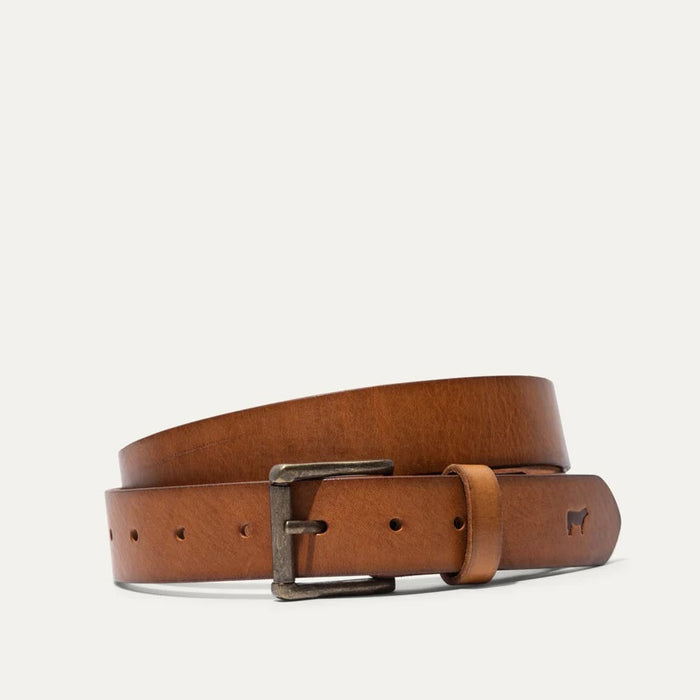 The WILL LEATHER GOODS - SADDLE BELT is a brown full-grain leather belt with a metal buckle and an embossed animal logo near the end, coiled on a plain white background—a timeless classic from WILL LEATHER GOODS for jeans.