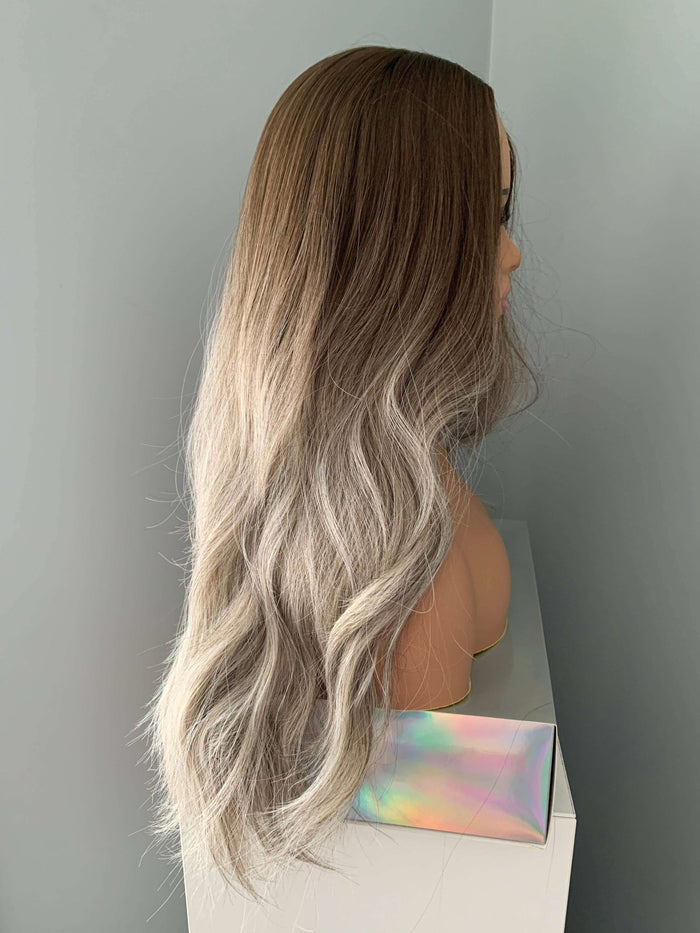 Side view of the Willow Long Wavy Grey Silver Wig, featuring loose waves and an ash brown base with silver highlights.