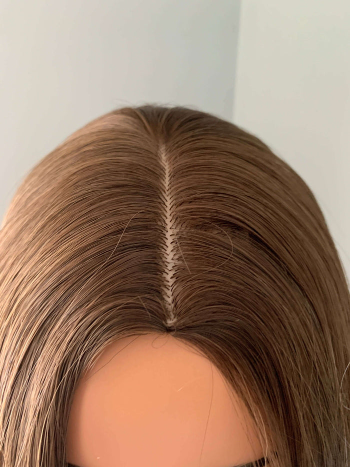 Close-up of the Willow Long Wavy Grey Silver Wig showing natural part and smooth hair texture.