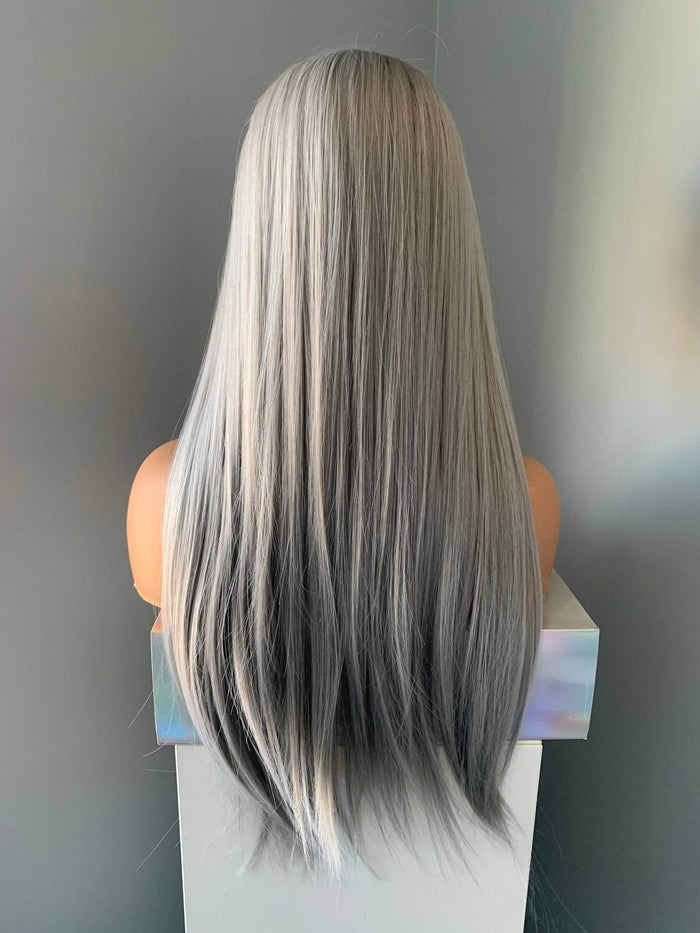 Back view of Winny Long Straight Grey Silver Wig showcasing silky strands and full bangs. Perfect Silver Wig for a modern look.