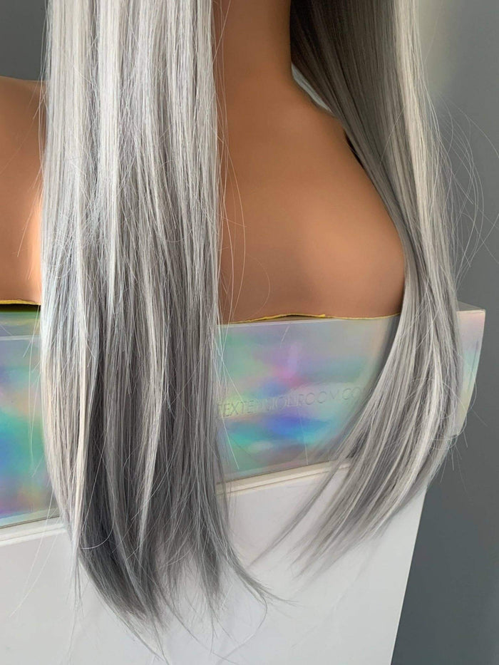 Long straight silver wig with bangs in grey and silver tones, showcasing sleek hairstyles and modern elegance.